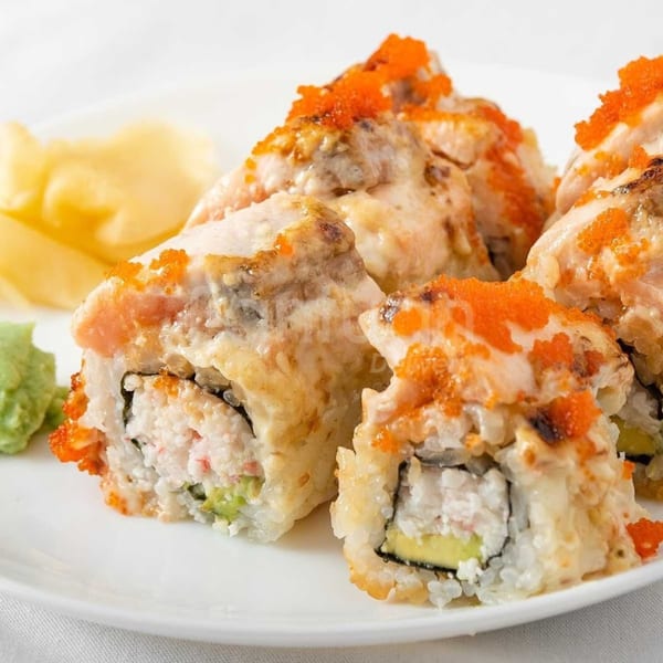 Koryo Sushi's baked sushi rolls with crab, avocado, and roe, served with ginger and wasabi.